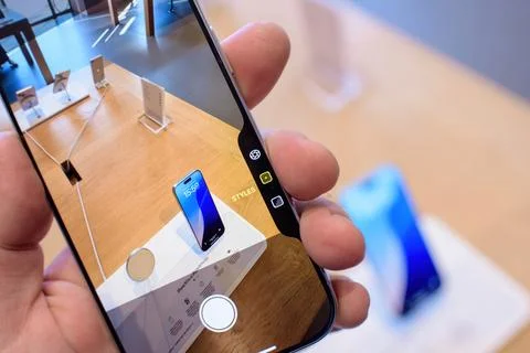 Testing Camera Settings on iPhone 16 Pro Display Stock Photos