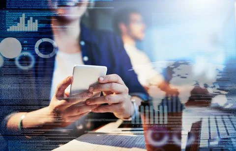 Testing the code on her smartphone. Cropped shot of computer programmers work Stock Photos