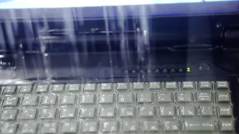 Testing of computer equipment for water resistance. Video stock 206110355