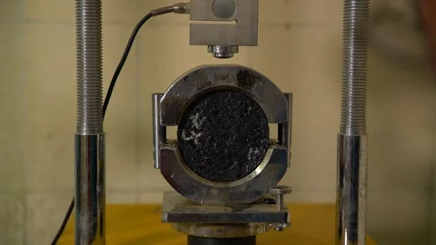 Testing Concrete core sample in a civil engineering lab to check its compre.. Stock Footage 329211037