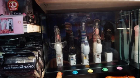 Testing crazy dildos in a Japanese store Stock Footage 108569921