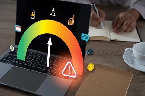 A testing critical of qa testing laptop with digital gauge showing warning al Stock Photos