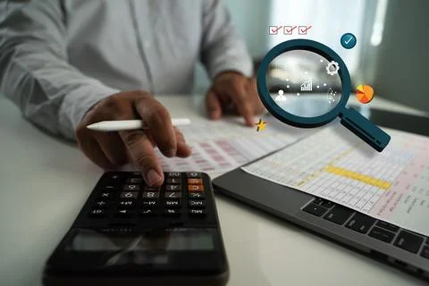 A testing critical of qa testing person using calculator and analyzing financ Stock Photos