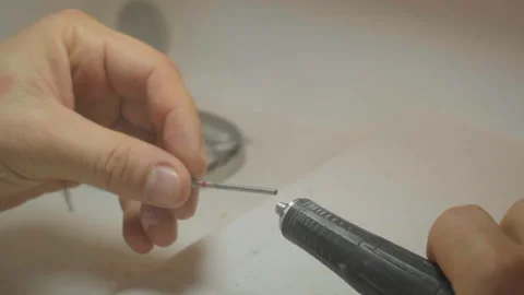 Testing different attachments of the newest of a dental model polishing tool Stock Footage 218256791