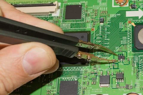 Testing digital electronics with a multimeter and troubleshooting Stock Photos