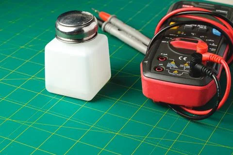Testing electrical devices with a multimeter and a measurement bottle Stock Photos