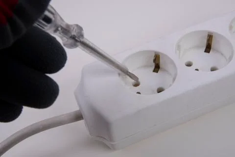 Testing energy with voltage tester Stock Photos