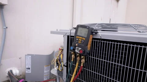 Testing equipment on a HVAC or heating and air conditioning system Stock Footage 152862447
