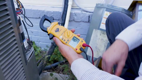 Testing equipment on a HVAC or heating and air conditioning unit Stock Footage 152862918