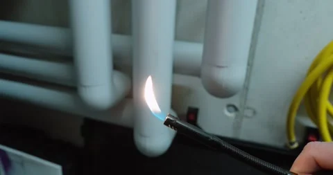 Testing Fire-Resistant Pipe Insulation with Flame 動画素材 331123790
