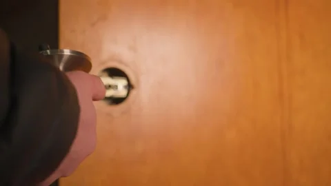 Testing the fit of new hardware into the old door knob's slot. Stock Footage 327308587
