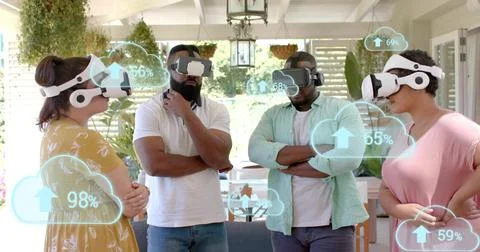 Testing four colleagues trying VR demo on porch, wearing white headsets, mustard Stock Photos