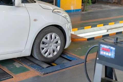 Testing front wheel center and brake system. Stock Photos
