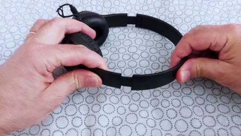 Testing Headphone Durability: Flexibility in Action Video stock 311041046