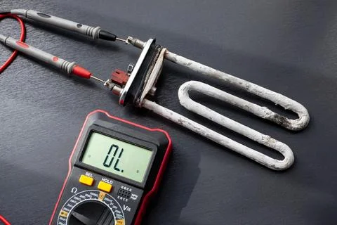 Testing the heater of a sewing machine for functionality and safety measures 写真素材
