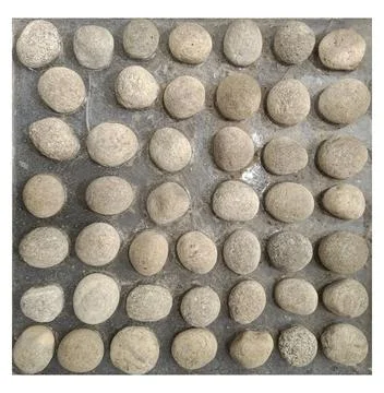 Testing hiking boots on an artificial surface made of round pebbles to eval.. Stock Photos