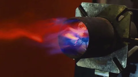Testing home heating gas burner after making repairs on spark ignition electrode Stock Footage 81808774