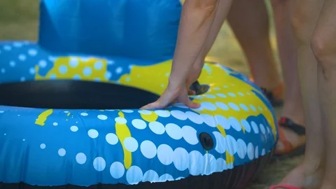 Testing an Inner Tube For Inflation and Taking it Away Stock Footage 92631602
