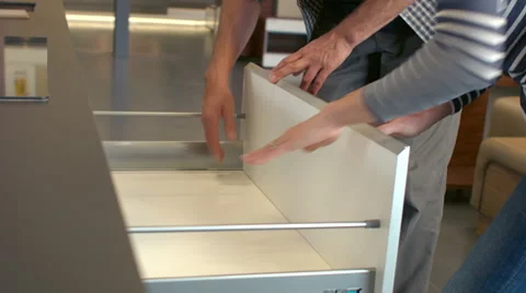 Testing kitchen drawers in showroom Stock Footage 60789023