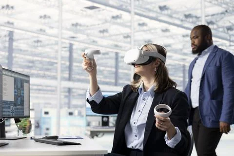 Testing microchip electronics prototypes, VR and multiethnic engineering team Stock Photos