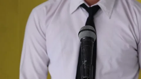 Testing a microphone by tapping it with the finger, close up Stock Footage 154031470