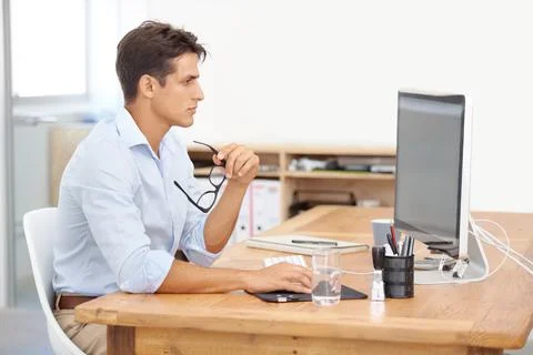 Testing out the new website. A handsome young businessman holding his glasses Stock Photos
