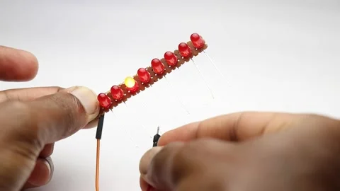 Testing row of colorful shining led lights connected to an empty pcb 스톡 동영상 169675872