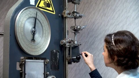 Testing of rubber specimen in load – elongation mode on tensile machine. Stock Footage 109129028