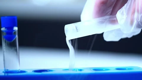 Testing sample of liquid in test tube Video stock 305635556