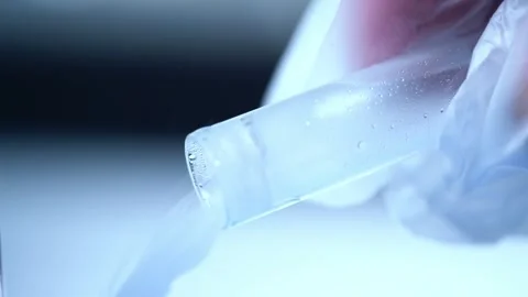 Testing sample of liquid in test tube Stock Footage 307834240