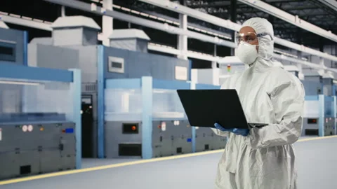 Testing silicon wafer batches, laptop software and specialist Stock Footage 333395489