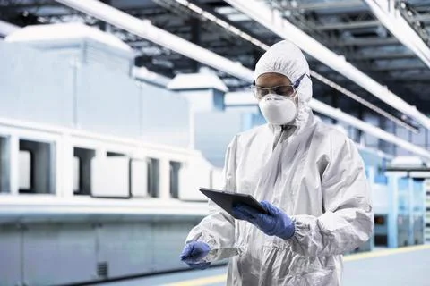 Testing silicon wafer batches, tablet control app and technician Stock Photos