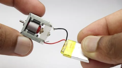 Testing small electric dc motor with mini lithium polymer battery Stock Footage 346665431