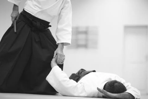 Testing of special exercises in training Aikido with a dagger Stock Photos