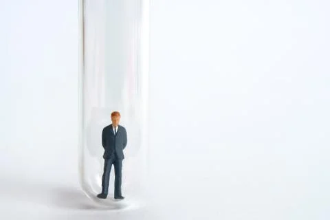 Testing specimen, a businessman on a laboratory test tube Foto stock