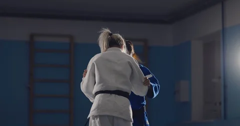 Testing techniques in the fight. Young beautiful women fight on the tatami Video stock 116841841