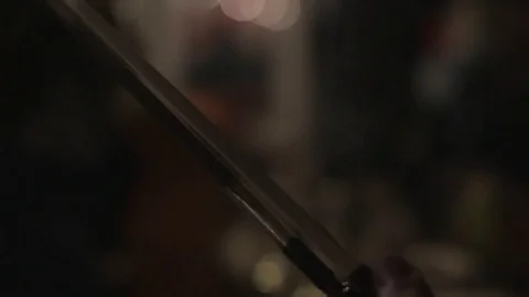 Testing the Tension of a Violin Bow Stock Footage 76875012