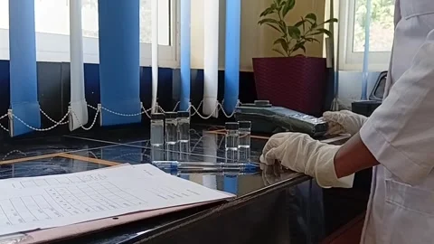 Testing Water Turbidity and Recording Data Video stock 333298718