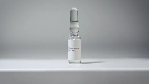 Testosterone Ampoule On Table, TRT Medication Concept Stock Footage 331751711