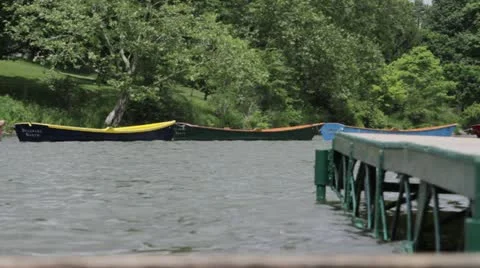 Tethered rowboats by dock low angle 動画素材 11139718
