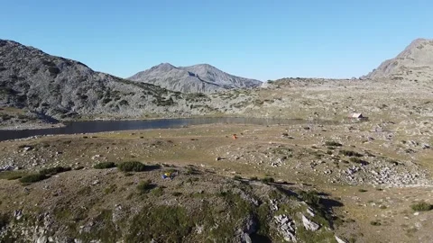 Tevno Ezero Alpine Lake Surrounded by Pirin Mountains – Aerial Drone Footage Stock Footage 332012330