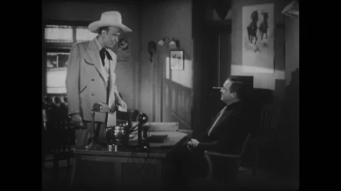 TEXAS - 1943 - In this western, two men speak in an office and a man pulls a gun Stock Footage 323222977