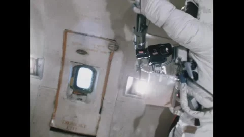 TEXAS - 1971 - An astronaut assembles a piece of lunar hardware aboard a KC-135. Stock Footage 340665887