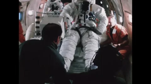 TEXAS - 1971 - NASA technicians assist an astronaut seated in a lunar rover for Stock Footage 340665863