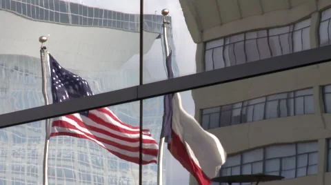 Texas and American Flag Reflected in Building Zoom Out Stock Footage 68647487