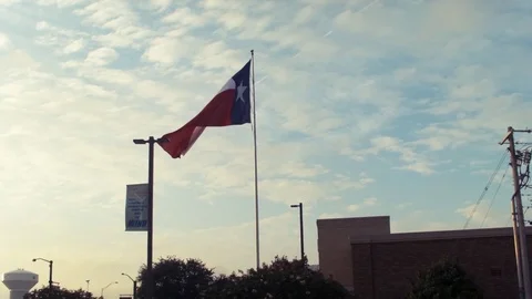 Texas Flag Blowing in the Wind Dolly Wide Stock Footage 70347652