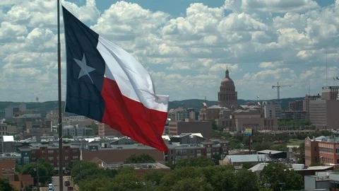 Texas Flag with Capital in background in Austin, Texas, aerial 4K. part 3 스톡 동영상 111067698