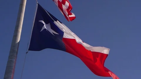 Texas Flag waving in slow motion, closeup, windy day. Stock Footage