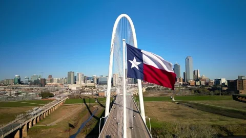Texas state flag and Modern Margaret Hunt Hill Bridge over Trinity river in.. Stock Footage 301734698