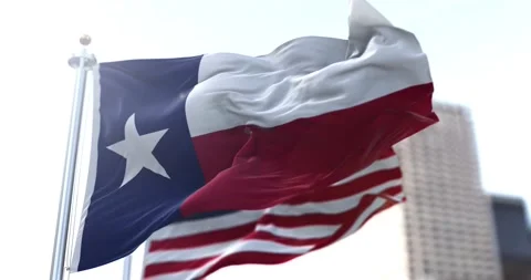 The Texas state flag flapping in the wind with the American national flag Stock Footage 154350295